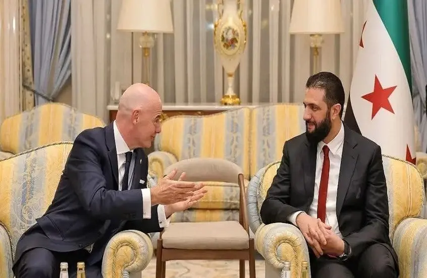 صورة حول : الشرع يلتقي رئيس الفيفا الشرع يلتقي رئيس الفيفا